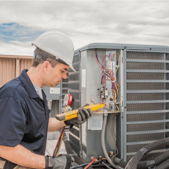 Hanover Heating & Cooling HVAC technician on a service call in Hanover, Ontario